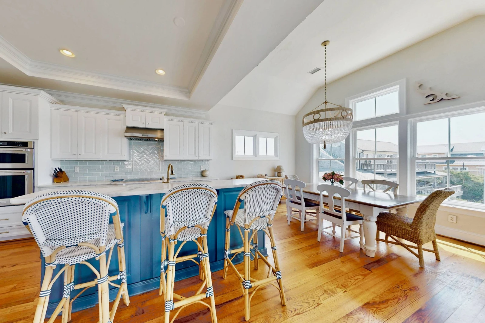 The kitchen opens to the dining area with sound views