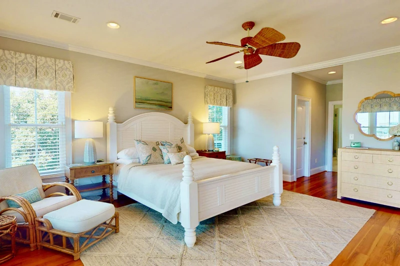 The owner's suite is spacious with a king bed, sitting area and full ensuite bathroom