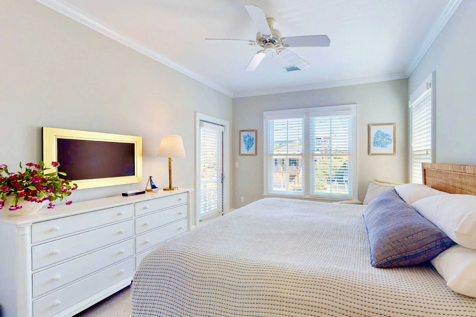 This bedroom also offers a wall mounted tv and a small sitting area