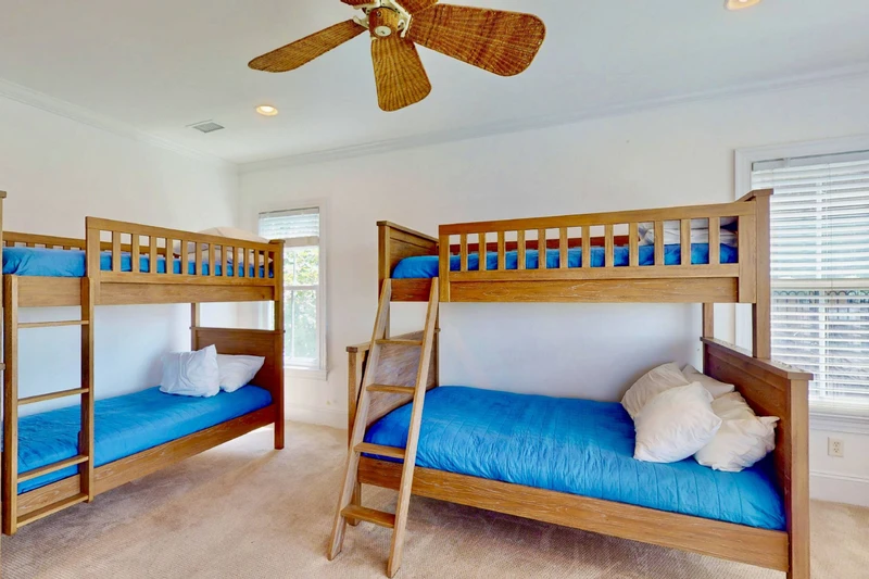 The bunk room features a twin over full bunk and a twin over twin bunk