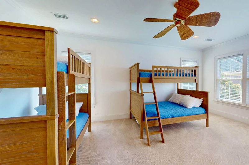 The bunk room has direct access to the second floor sound facing deck