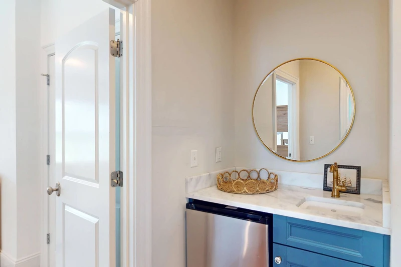 A wet bar on the second floor offers a mini fridge and sink