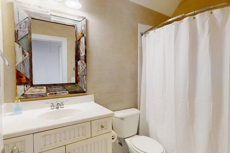 Top floor hall bathroom has a tub/shower combo