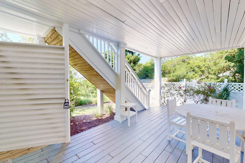 Ground floor covered patio and seating area
