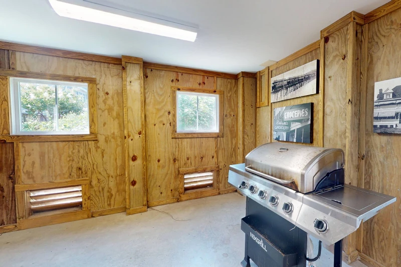 A grill can be found in the spacious garage to use outside